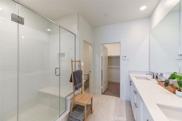 Bathroom, Dual Sink Vanities, Glass Shower, Interior, Recessed Lighting, Wood Texture Flooring