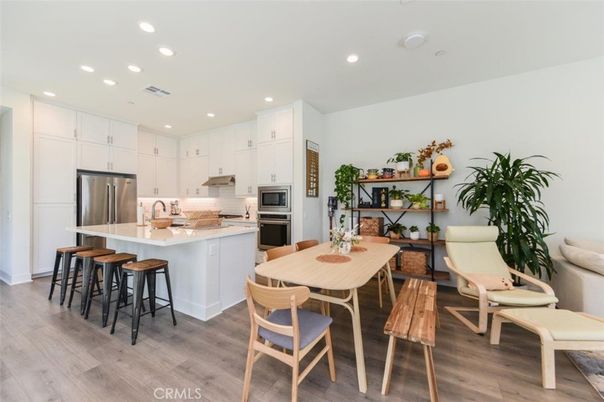 Dining room, Interior, Kitchen, Recessed Lighting, Stainless Steel Appliances, Wood Texture Flooring
