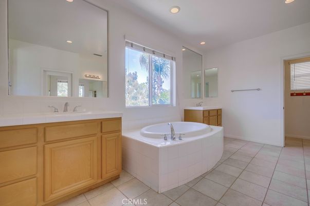 Bathroom, Dual Sink Vanities, Interior, Recessed Lighting, Tile Countertops