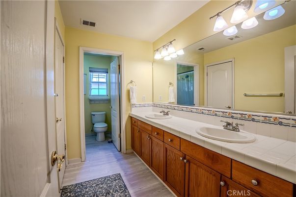 Bathroom, Dual Sink Vanities, Interior, Tile Countertops, Wood Texture Flooring