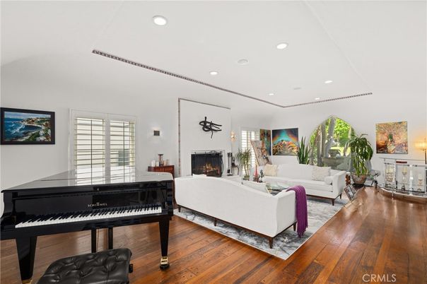 Fireplace, Interior, Living room, Piano, Recessed Lighting, Wood Texture Flooring