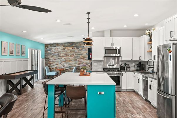 Dining room, Interior, Kitchen, Pendant Lights, Recessed Lighting, Stainless Steel Appliances, Stone Walls, Wood Texture Flooring