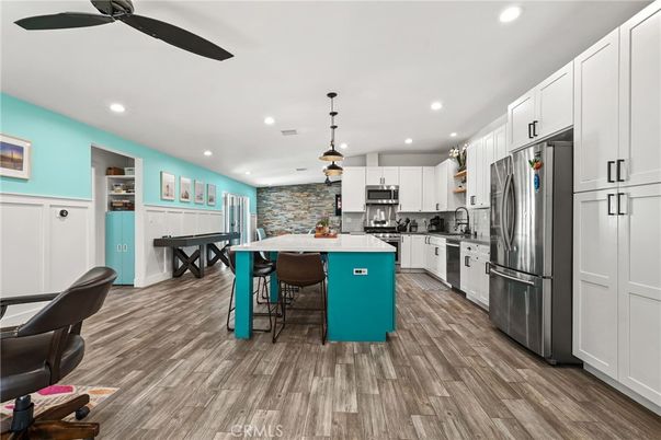 Dining room, Interior, Kitchen, Pendant Lights, Recessed Lighting, Stainless Steel Appliances, Stone Walls, Wood Texture Flooring