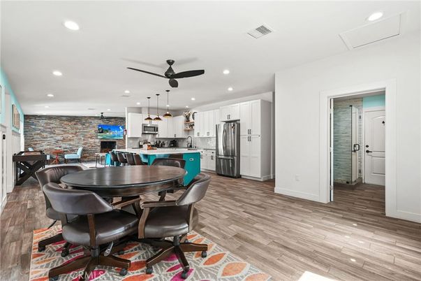 Dining room, Interior, Kitchen, Pendant Lights, Recessed Lighting, Stainless Steel Appliances, Stone Walls, Wood Texture Flooring