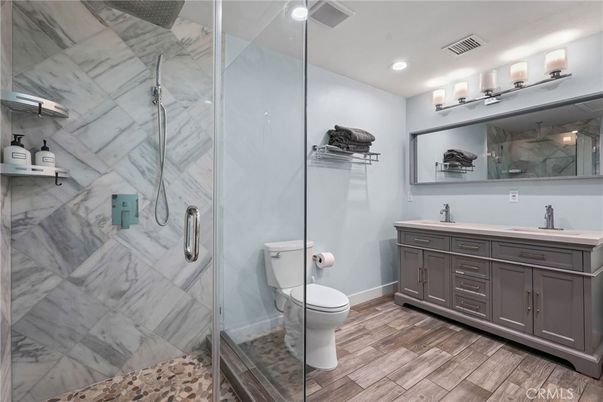 Bathroom, Glass Shower, Interior, Marble Walls, Recessed Lighting, Wood Texture Flooring
