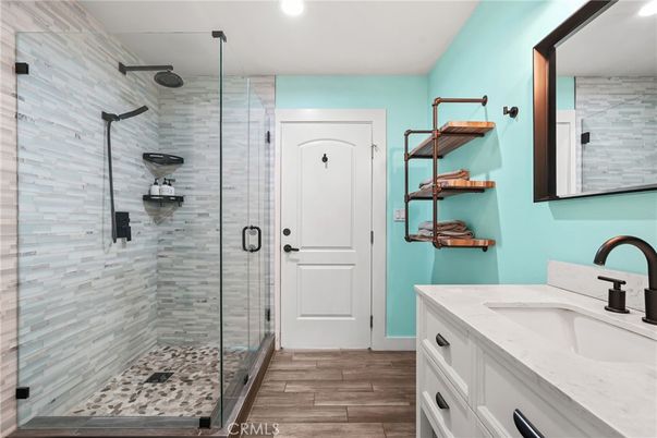 Bathroom, Dual Sink Vanities, Glass Shower, Interior, Recessed Lighting, Wood Texture Flooring
