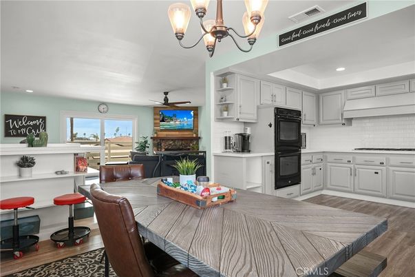 Chandelier, Dining room, Fireplace, Interior, Kitchen, Recessed Lighting, Wood Texture Flooring