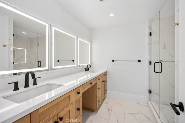 Bathroom, Dual Sink Vanities, Glass Shower, Interior, Marble, Marble Walls, Recessed Lighting