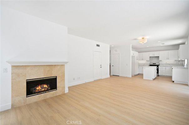 Empty room, Fireplace, Interior, Kitchen, Recessed Lighting, Wood Texture Flooring