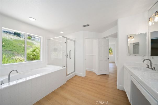 Bathroom, Dual Sink Vanities, Glass Shower, Interior, Recessed Lighting, Wood Texture Flooring