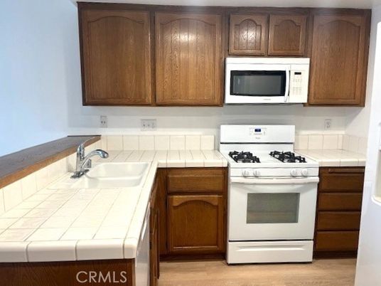 Interior, Kitchen, Tile Countertops, Wood Texture Flooring