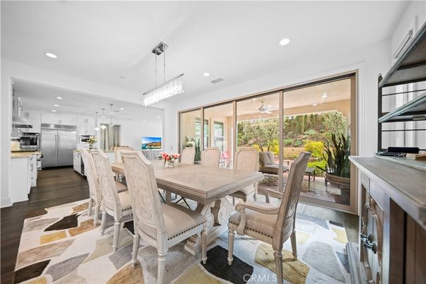 Chandelier, Dining room, Interior, Kitchen, Pendant Lights, Recessed Lighting, Stainless Steel Appliances, Wood Texture Flooring