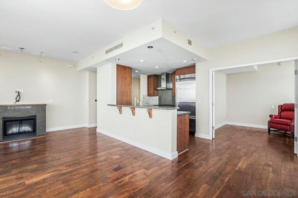 Fireplace, Interior, Kitchen, Recessed Lighting, Stainless Steel Appliances, Wood Texture Flooring