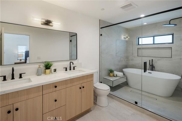Bathroom, Dual Sink Vanities, Free Standing Baths, Glass Shower, Interior, Marble Walls, Recessed Lighting