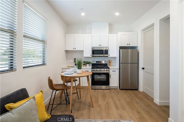 Dining room, Interior, Kitchen, Recessed Lighting, Stainless Steel Appliances, Wood Texture Flooring