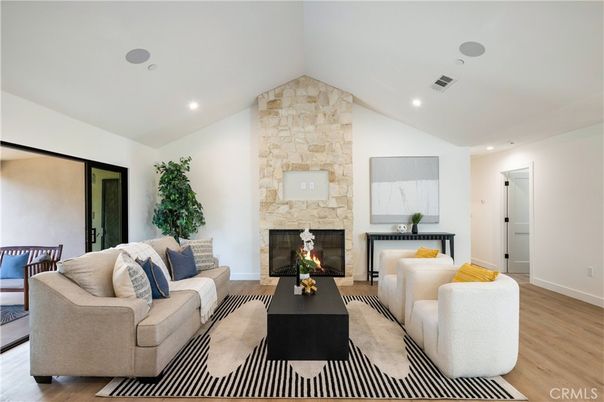 Fireplace, Interior, Living room, Recessed Lighting, Stone Walls, Wood Texture Flooring