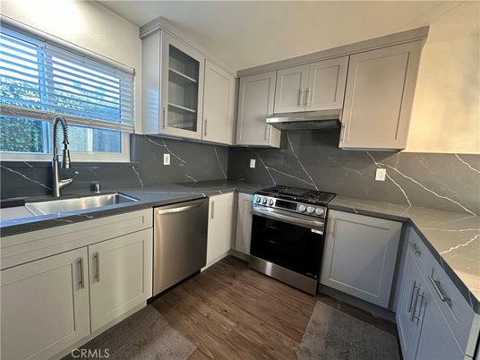 Interior, Kitchen, Marble Walls, Stainless Steel Appliances, Wood Texture Flooring