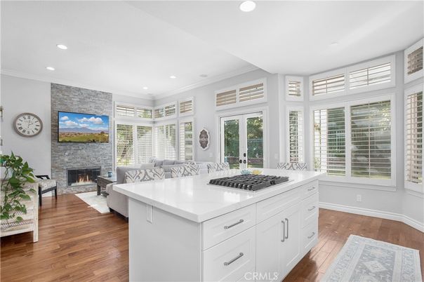 Fireplace, Interior, Kitchen, Living room, Recessed Lighting, Stone Walls, Wood Texture Flooring