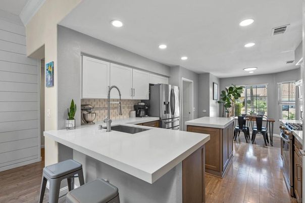 Dining room, Interior, Kitchen, Recessed Lighting, Stainless Steel Appliances, Wood Texture Flooring