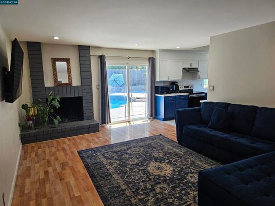Fireplace, Interior, Kitchen, Living room, Recessed Lighting, Wood Texture Flooring