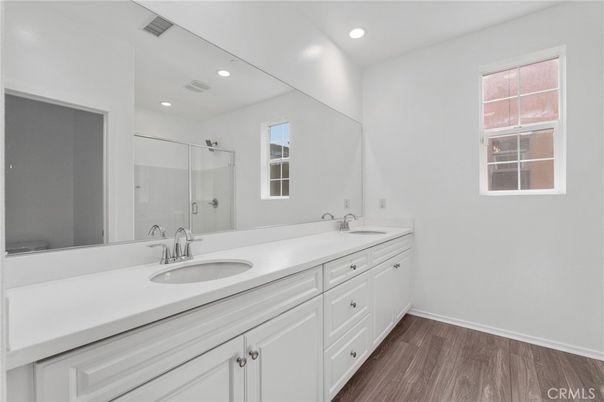 Bathroom, Dual Sink Vanities, Interior, Recessed Lighting, Wood Texture Flooring