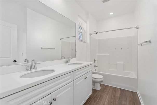 Bathroom, Dual Sink Vanities, Interior, Recessed Lighting, Wood Texture Flooring