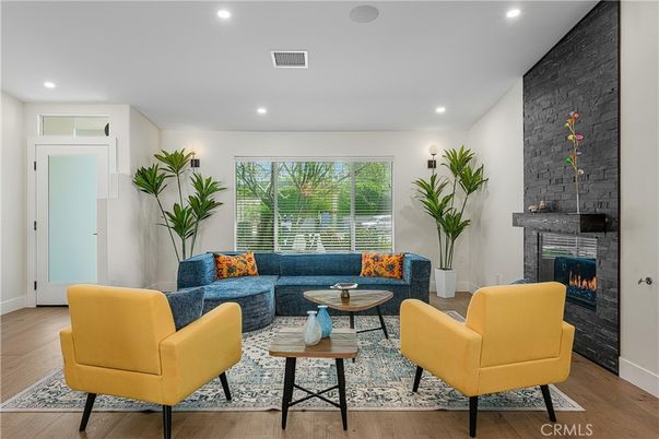 Fireplace, Interior, Living room, Recessed Lighting, Stone Walls, Wood Texture Flooring