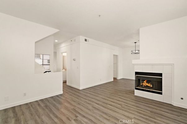 Empty room, Fireplace, Interior, Pendant Lights, Recessed Lighting, Wood Texture Flooring