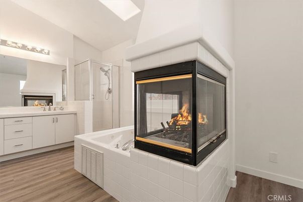 Bathroom, Fireplace, Glass Shower, Interior, Wood Texture Flooring