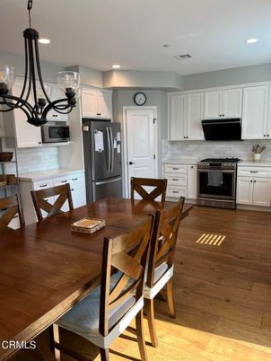 Dining room, Interior, Kitchen, Recessed Lighting, Stainless Steel Appliances, Wood Texture Flooring