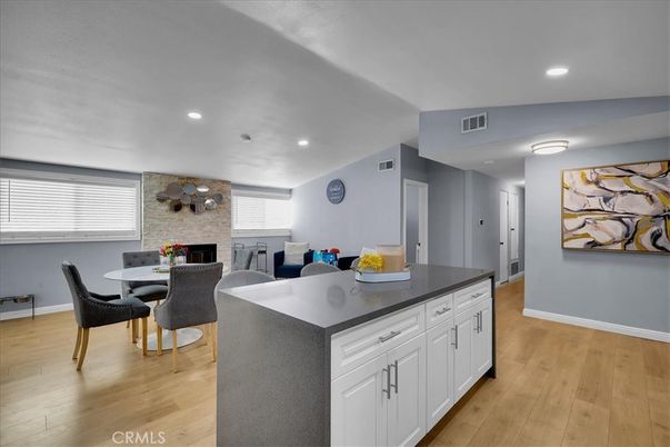Dining room, Fireplace, Interior, Kitchen, Recessed Lighting, Stone Walls, Wood Texture Flooring