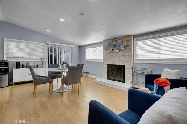 Dining room, Fireplace, Interior, Living room, Recessed Lighting, Stone Walls, Wood Texture Flooring