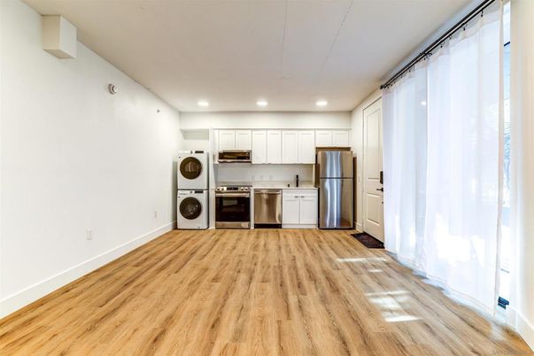 Interior, Kitchen, Recessed Lighting, Stainless Steel Appliances, Washer, Wood Texture Flooring