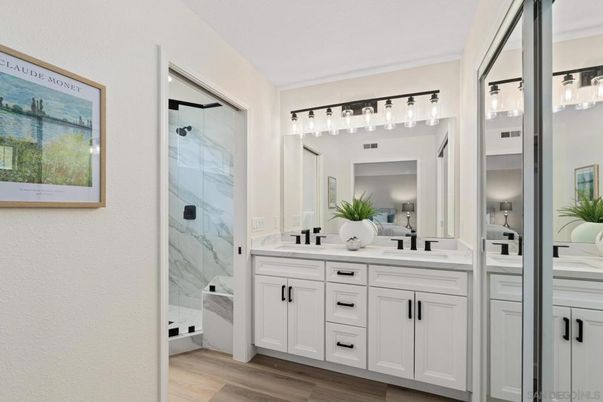Bathroom, Dual Sink Vanities, Glass Shower, Interior, Marble Walls, Wood Texture Flooring