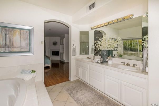 Bathroom, Dual Sink Vanities, Fireplace, Interior, Wood Texture Flooring