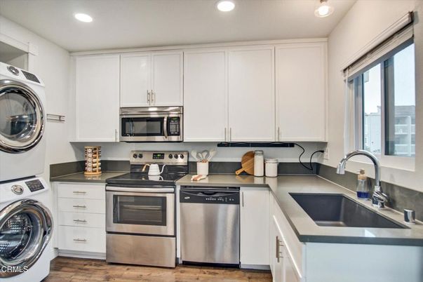 Interior, Kitchen, Recessed Lighting, Stainless Steel Appliances, Washer, Wood Texture Flooring