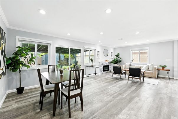 Dining room, Fireplace, Interior, Living room, Recessed Lighting, Wood Texture Flooring