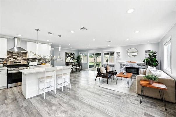 Dining room, Fireplace, Interior, Kitchen, Living room, Pendant Lights, Recessed Lighting, Stainless Steel Appliances, Wood Texture Flooring