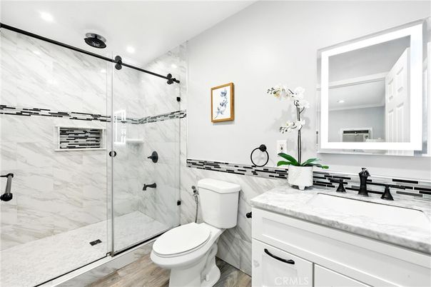 Bathroom, Glass Shower, Interior, Marble Walls, Recessed Lighting, Wood Texture Flooring