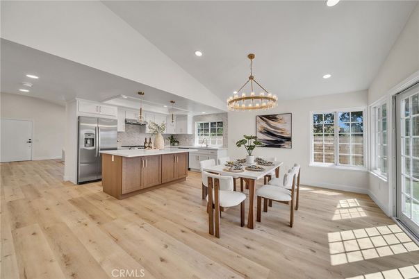 Chandelier, Dining room, Interior, Kitchen, Pendant Lights, Recessed Lighting, Stainless Steel Appliances, Wood Texture Flooring
