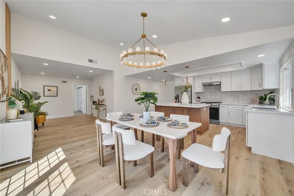 Chandelier, Dining room, Interior, Kitchen, Pendant Lights, Recessed Lighting, Stainless Steel Appliances, Wood Texture Flooring