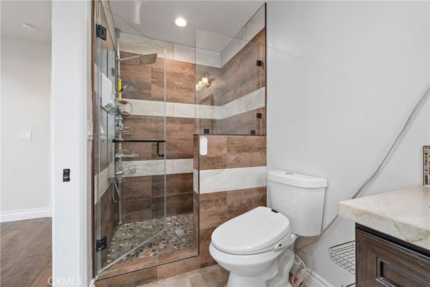 Bathroom, Glass Shower, Interior, Recessed Lighting, Wood Texture Flooring