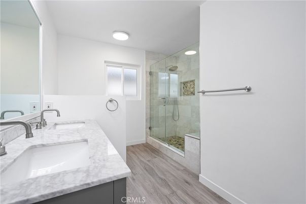 Bathroom, Dual Sink Vanities, Glass Shower, Interior, Recessed Lighting, Wood Texture Flooring
