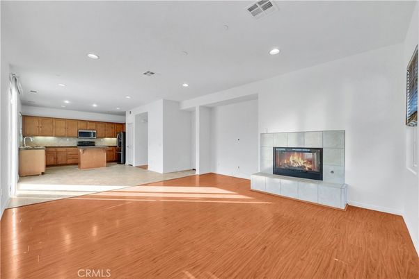 Empty room, Fireplace, Interior, Kitchen, Recessed Lighting, Wood Texture Flooring