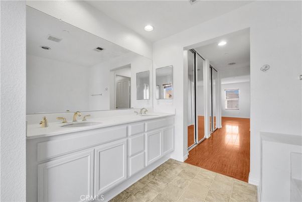 Bathroom, Dual Sink Vanities, Interior, Recessed Lighting, Wood Texture Flooring