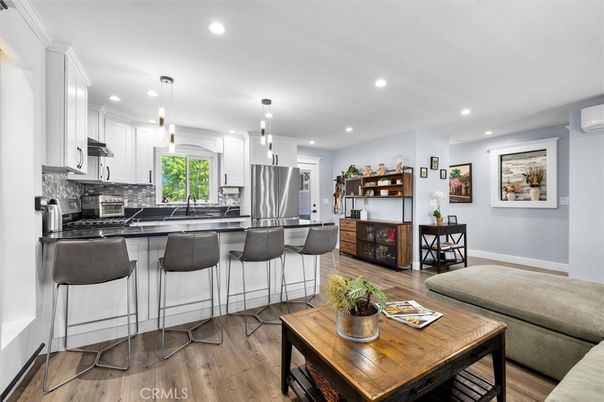Dining room, Interior, Kitchen, Living room, Pendant Lights, Recessed Lighting, Stainless Steel Appliances, Wood Texture Flooring