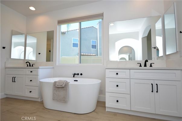 Bathroom, Dual Sink Vanities, Free Standing Baths, Interior, Recessed Lighting, Wood Texture Flooring