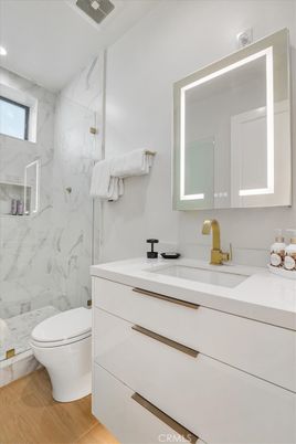 Bathroom, Glass Shower, Interior, Marble Walls, Recessed Lighting, Wood Texture Flooring