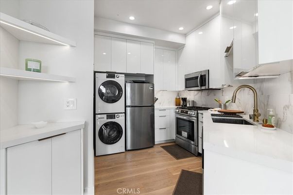 Interior, Kitchen, Recessed Lighting, Stainless Steel Appliances, Washer, Wood Texture Flooring