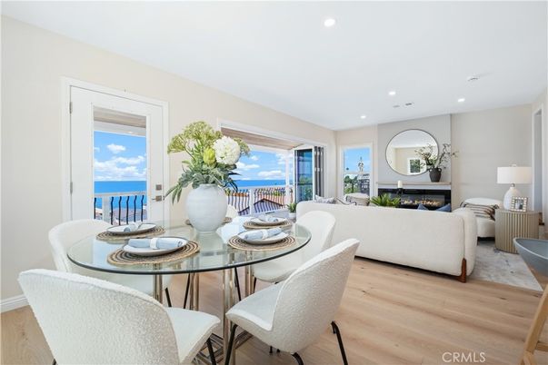 Dining room, Fireplace, Interior, Living room, Recessed Lighting, Water, Wood Texture Flooring